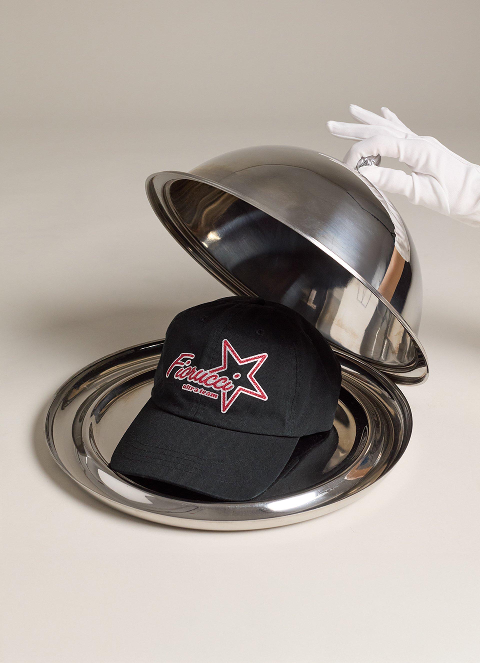 The picture features the Ultra Team Glitter Star Logo Cap in Black.